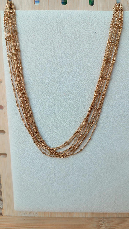 Collar acero dorado